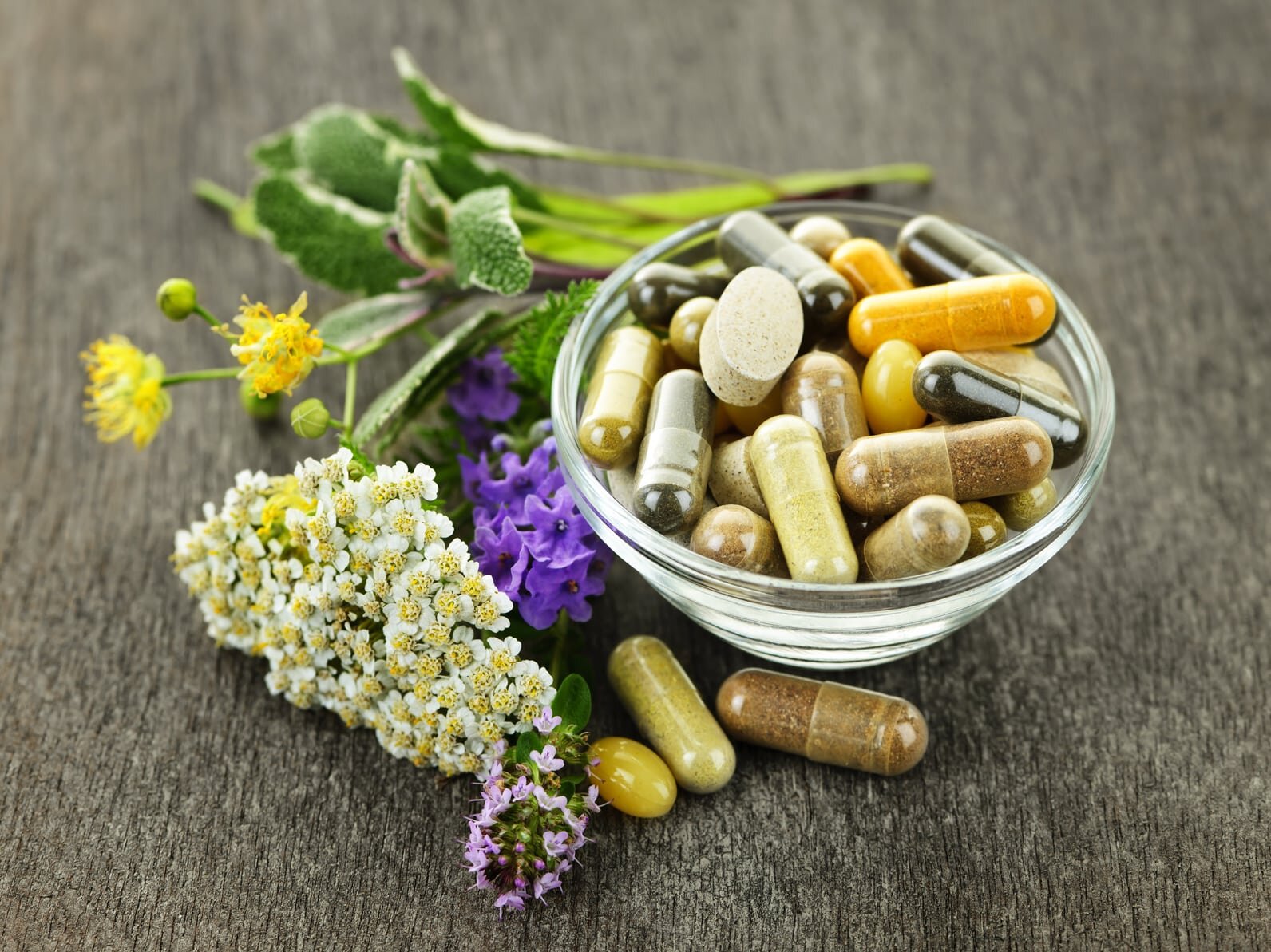Naturopathic doctor consulting a patient with herbal remedies
